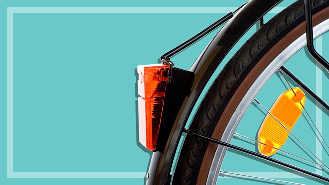 rear wheel of bicycle showing rear bike light